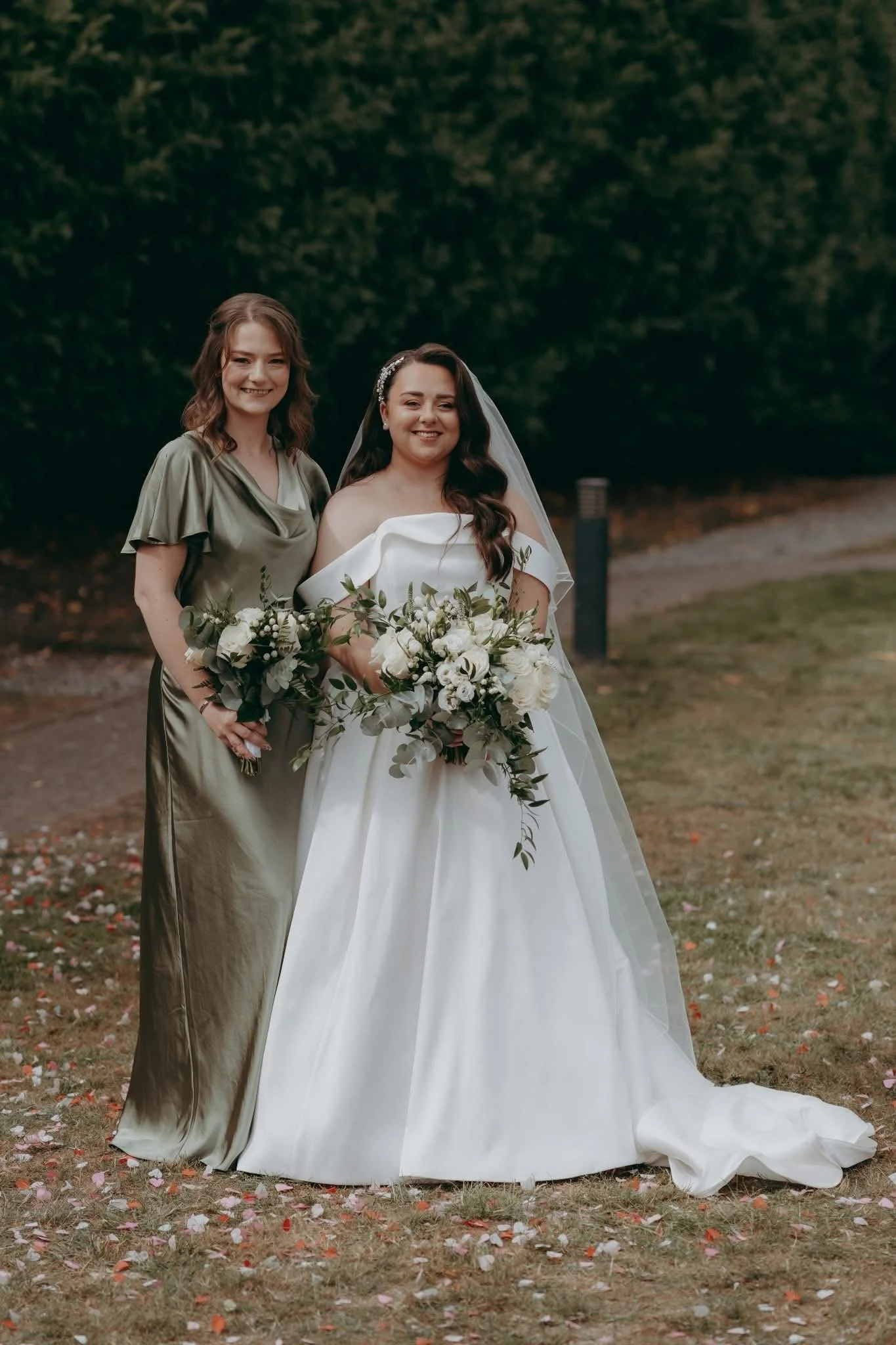 Molly & Ben bridal hair at Lazaat — the bride outdoors holding her bouquet.